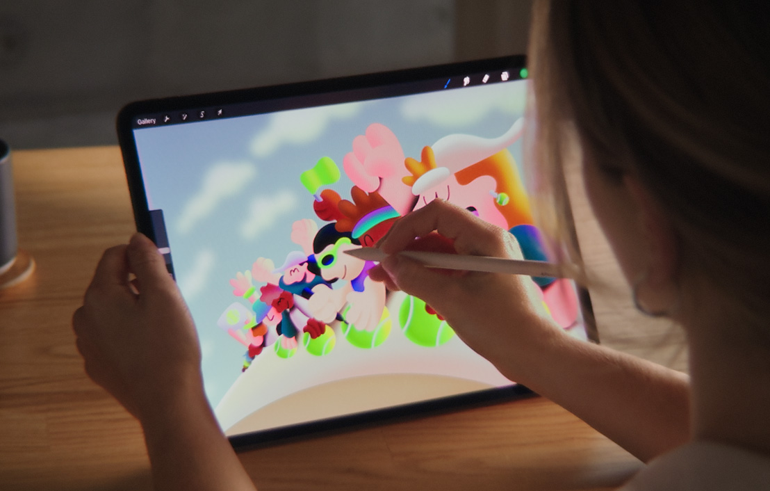 An artist using Apple Pencil Pro and iPad Pro to draw within Procreate.