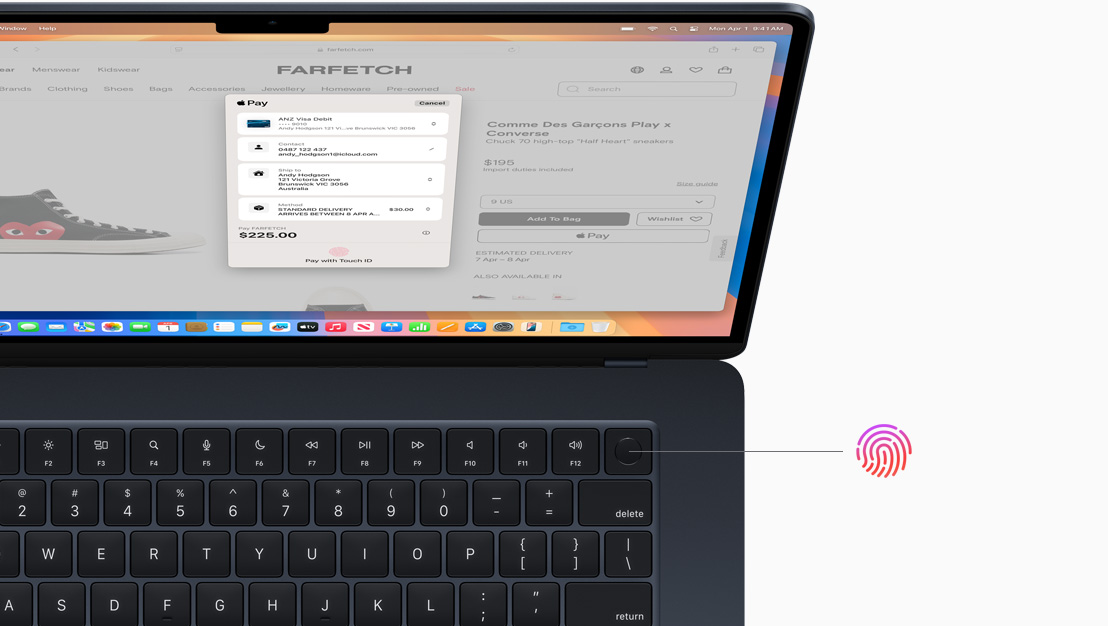 An open MacBook Pro in Space Black, demonstrating the location of the Touch ID button.