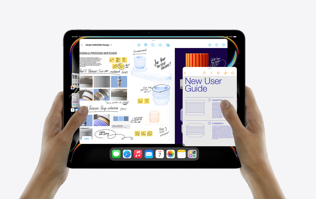 A pair of hands holding an iPad Pro showcasing  Stage Manager to multitask between Calendar, Freeform, Mail, Pages and the Photos app.