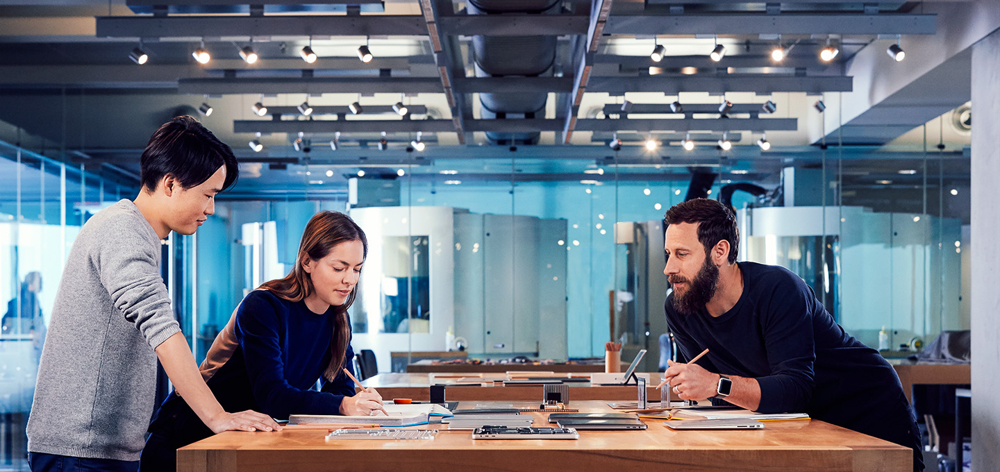 Apple designers collaborate on a project in their studio.