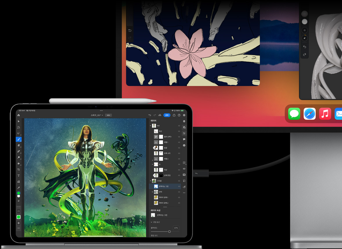 Magic Keyboard에 가로 방향으로 부착한 iPad Pro를 외장 디스플레이와 연결하고, iPad와 외장 디스플레이를 모두 사용해 이미지를 편집하고 있는 모습