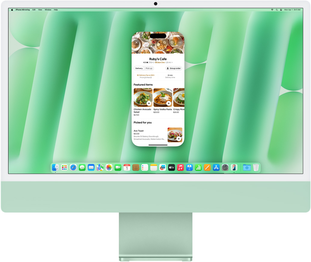 iPhone 鏡像輸出功能示範。 iMac 鏡像顯示並操控著 iPhone 螢幕上的 Uber Eats app。