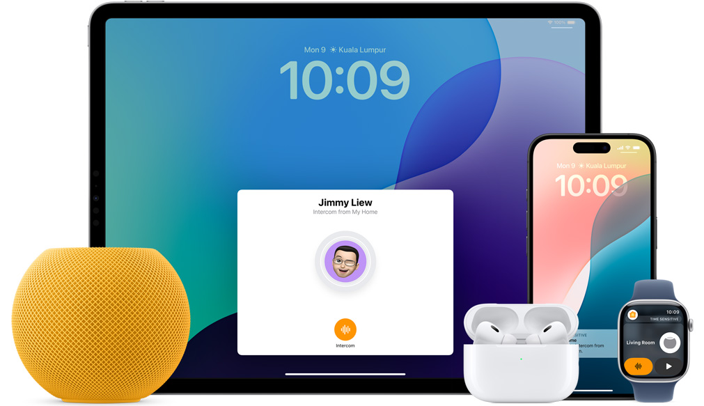 Yellow HomePod mini, an iPad, AirPods in a case, an iPhone and an Apple Watch with a pink strap are arranged.