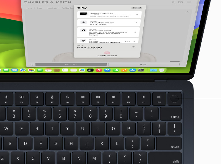 Top view of MacBook Air showcasing Touch ID and Magic Keyboard working with Apple Pay.