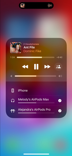 iPhone screen displays two sets of AirPods listening to 'All for Nothing (I'm So in Love)' by Lauv.